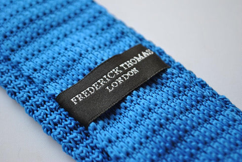 royal blue skinny knitted tie with orange polka dots